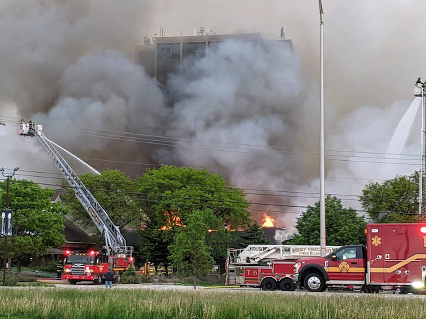 Flames and heavy smoke engulf several buildings at the former Pheasant Run Resort property in St. Charles on May 21, 2022.