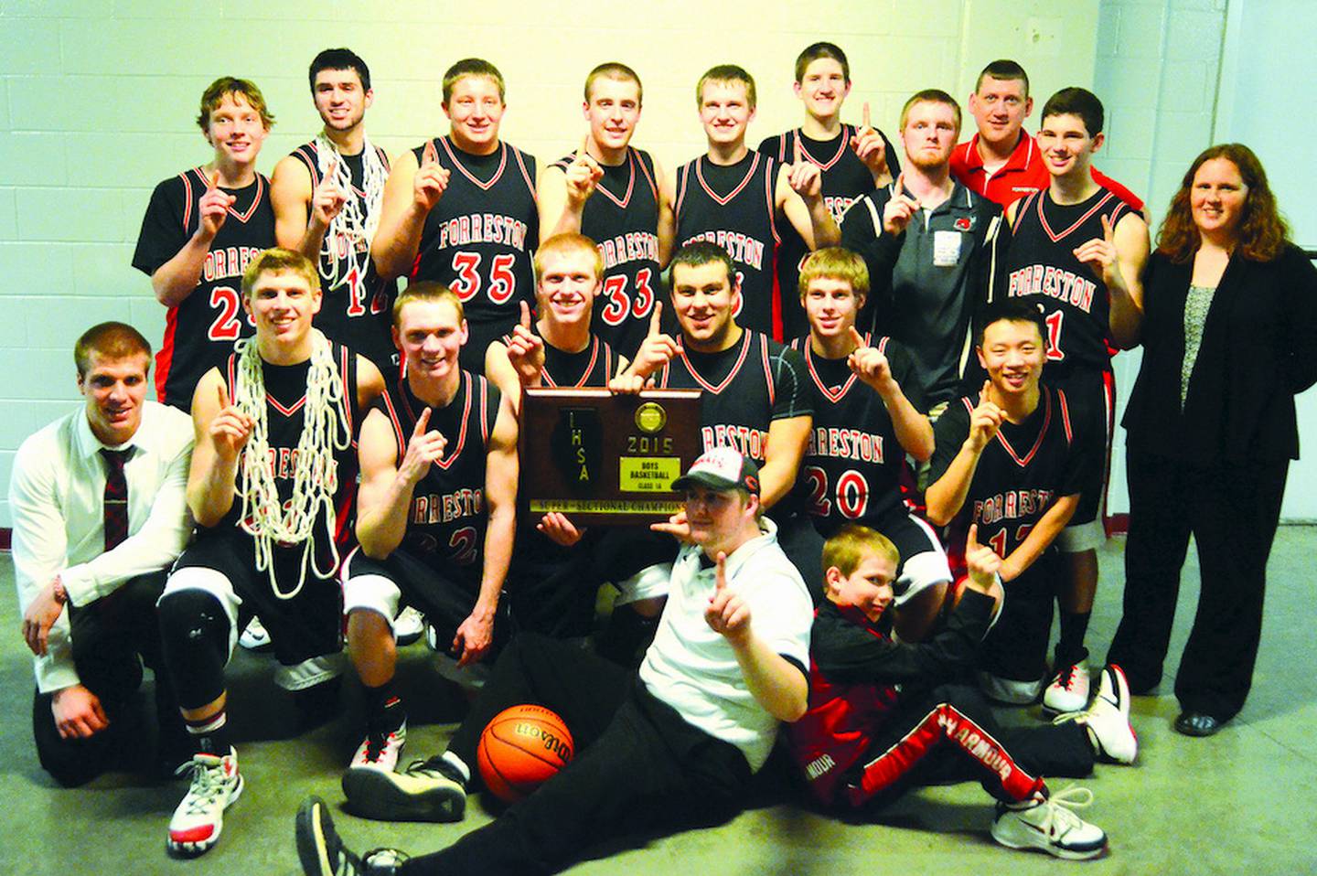 The Forreston Cardinals are pictured after winning a supersectional title. Seated are team manager Austin Howald, and Case DeVries. Kneeling area assistant coach Troy Stocker, Kaleb Reining, Aaron Shelton, Robert DeVries, Jacob Cunningham, Logan Rogers, and Ethan Groom. Standing are Austin Groshans, Wyatt Kerchner, Aidan Carr, Markus Edler, Ethan Groom, Nathan Schneiderman, team mangager Matt Beach, coach Travis Ross, Bryce Flick, and assistant coach Nicole Brinker. Photo by Chris Johnson