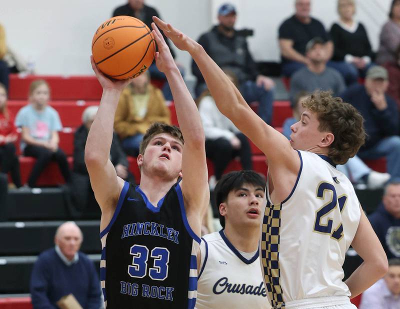 Hinckley-Big Rock's Marshall  Ledbetter goes to the basket against Marquette's Lucas Craig Tuesday, March 3, 2026, during their sectional semifinal matchup at Amboy High School.