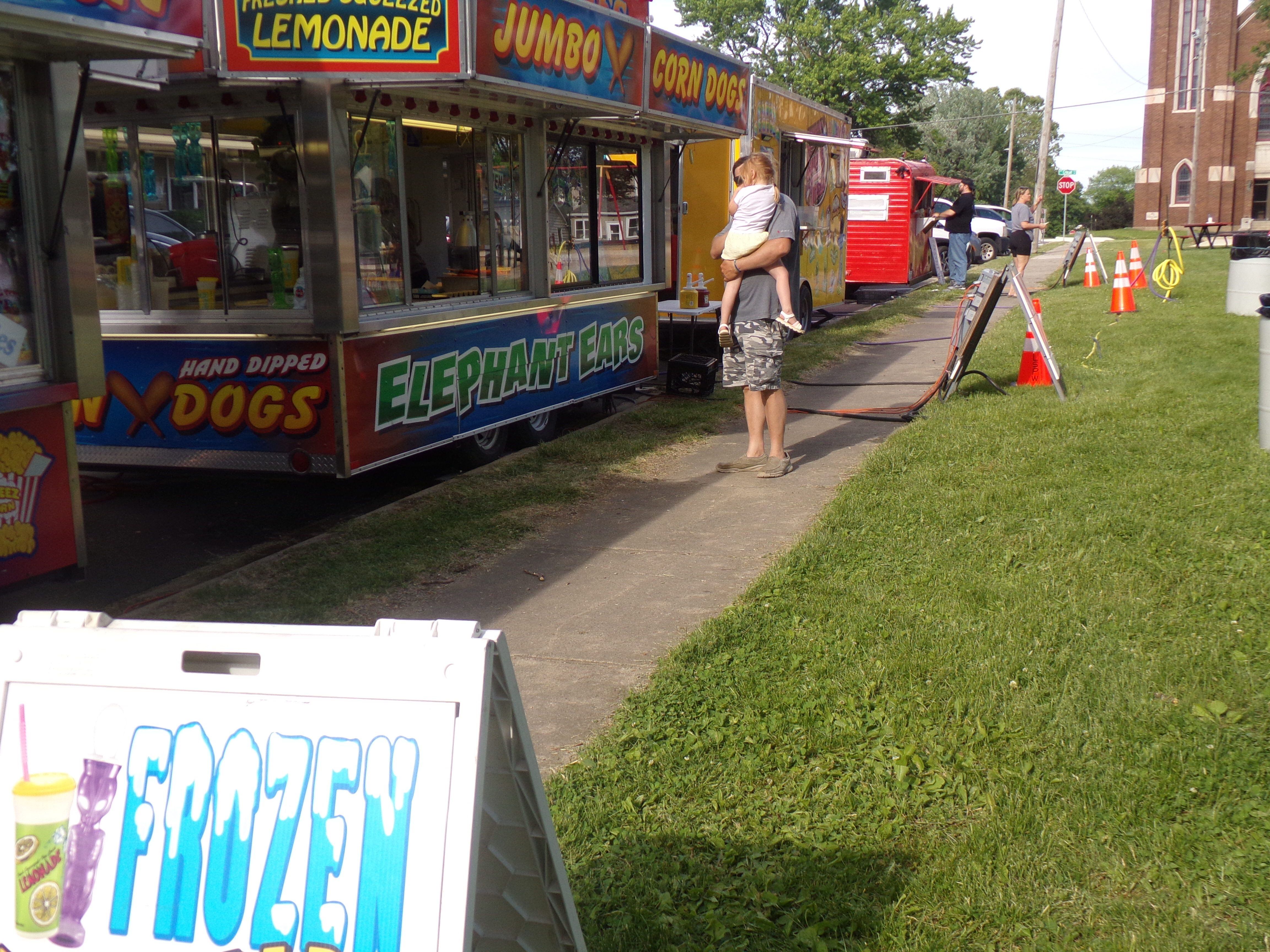 A row of food vendors supply treats for visitors Sunday, May 28, 2023, during the Music and Art Festival at Pulaski Park in La Salle.