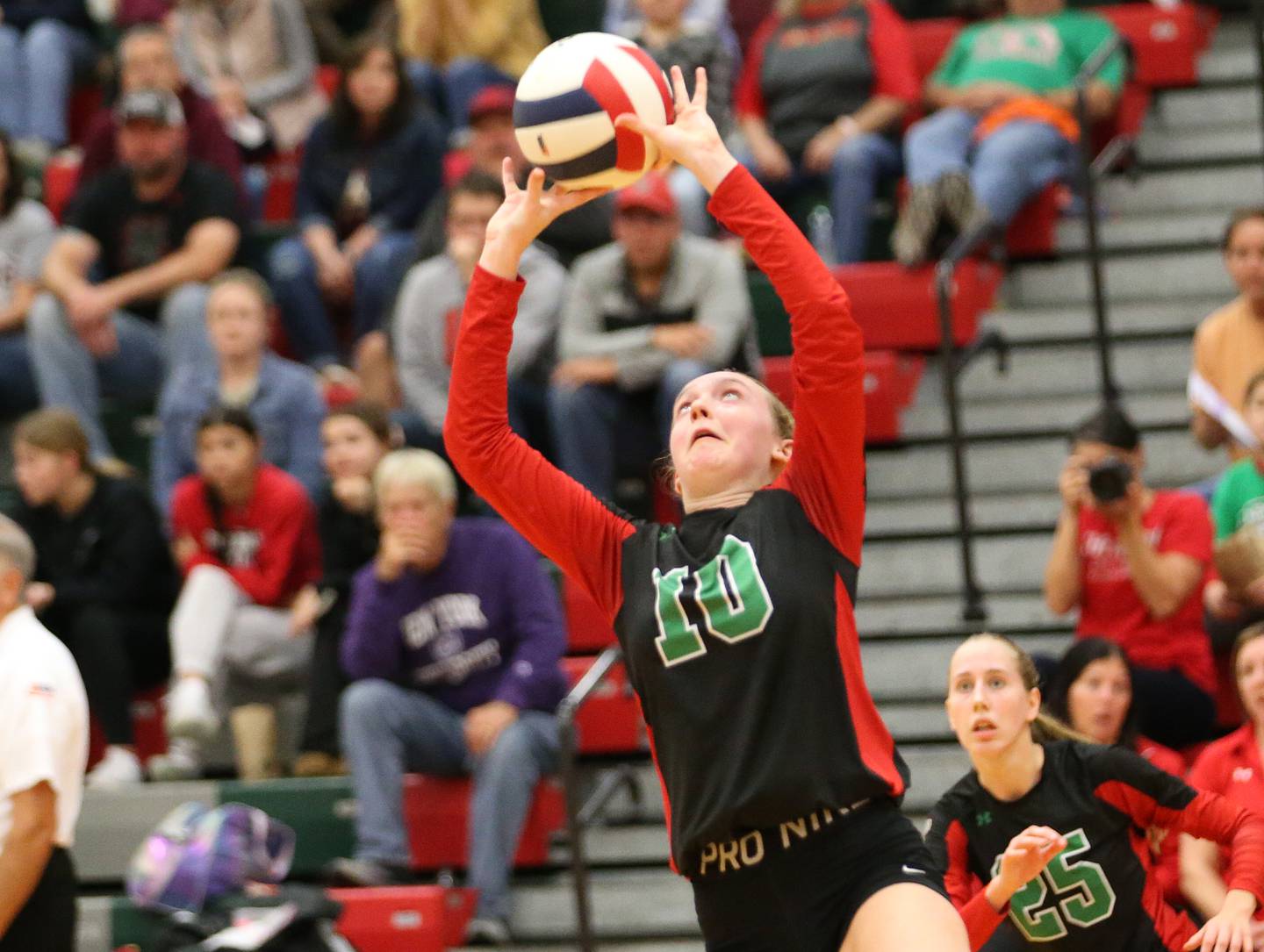 L-P's Katie Sowers sets the ball in play for teammate Addison Urbanski (behind) against Moris in the Class 3A Regional game on Thursday, Oct. 26, 2023 at Sellett Gymnasium.