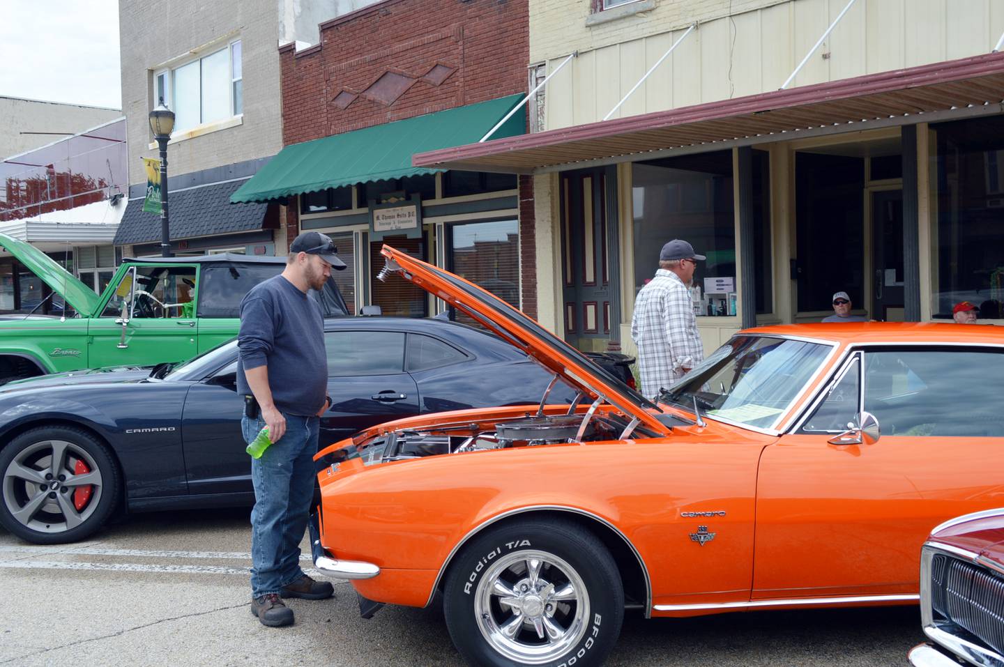 Steve Proper, of Sterling, looks at a 1967 Chevrolet Camaro owned by Connie Rainowski, of Rock Falls, during the 33rd annual Polo Car Show on Aug. 13.