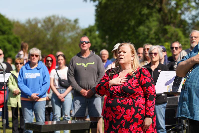 Karen Smietanski, assistant superintendent at the Veterans Assistance Commission of Kankakee County, sings the National Anthem with over 100 attendees during a ceremony dedicated to the late John Kirnbauer, a veteran whose ashes went unclaimed for five years, on Monday, May 26, 2025, at Kankakee Memorial Gardens.