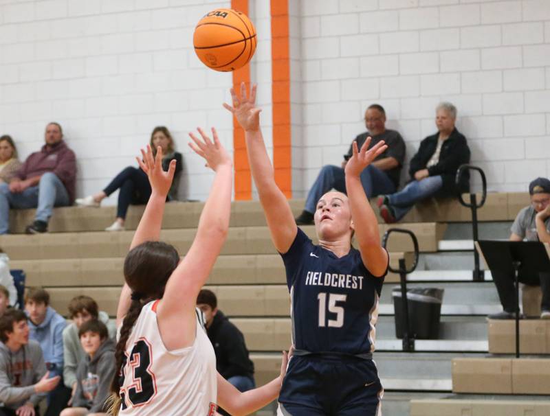 Fieldcrest's TeriLynn Timmerman shoots a jump shot over Flanagan-Cornell/Woodland's Chandler Weber during the Falcon-Irish Thanksgiving Tournament on Monday, Nov. 18, 2024 at Flanagan High School.