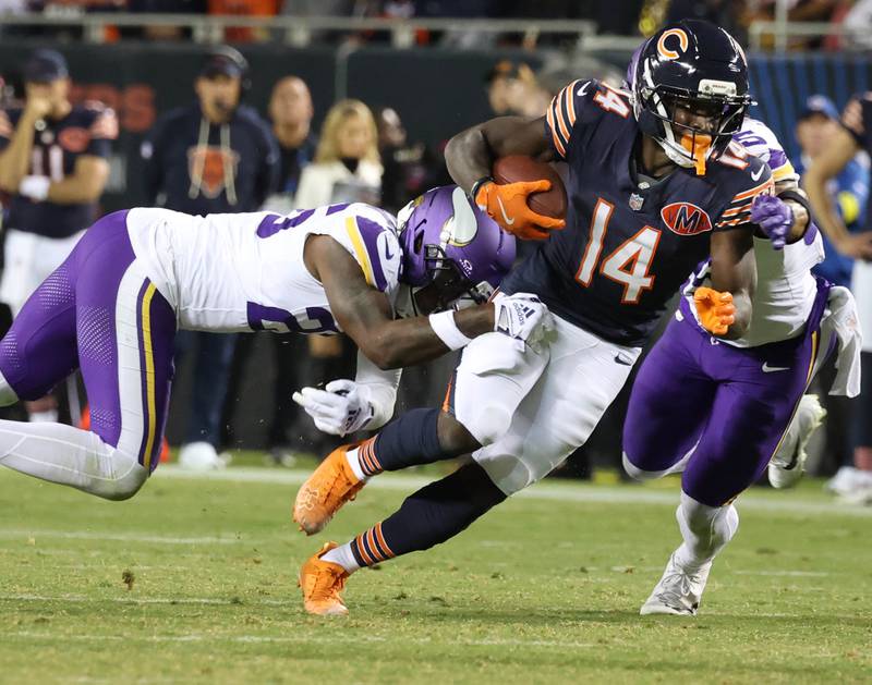Chicago Bears wide receiver Olamide Zaccheaus pulls away from Chicago Bears wide receiver JP Richardson during their game Monday, Sept. 8, 2025, at Soldier Field in Chicago.
