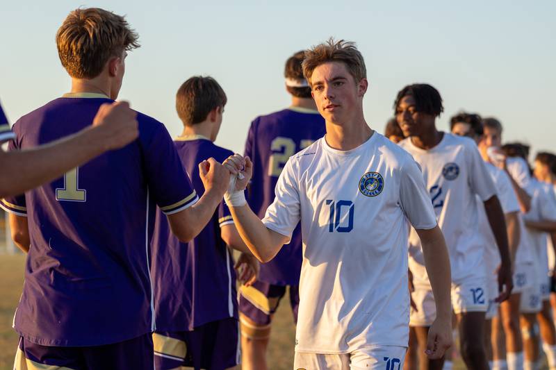Lane Rohrer (10) of Somonauk/Leland/Newark leads team in post-game high five line after win against Serena on Monday, Sept. 29, 2025, at Serena High School in Serena.