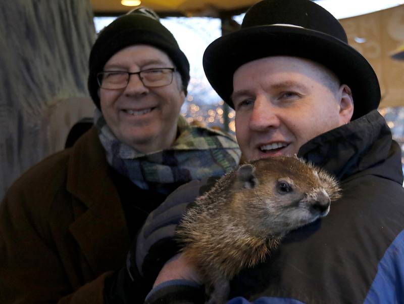 Stephen Tobolowsky who played "Ned Ryerson" in the movie "Groundhog Day" with  Woodstock Willie and his handler Mark Szafran on Sunday, Feb. 2, 2025, during the annual Groundhog Day Prognostication in the Woodstock Square.