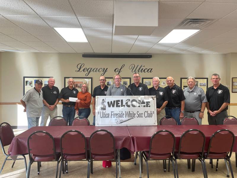 Members of the Utica Fireside White Sox Club recently presented a $1,500 donation to Lacey McNelis (fourth from left), qualified intellectual disability professional, Ottawa Friendship House. Since 2007, the club has raised and donated $55,100 to assist local charities.