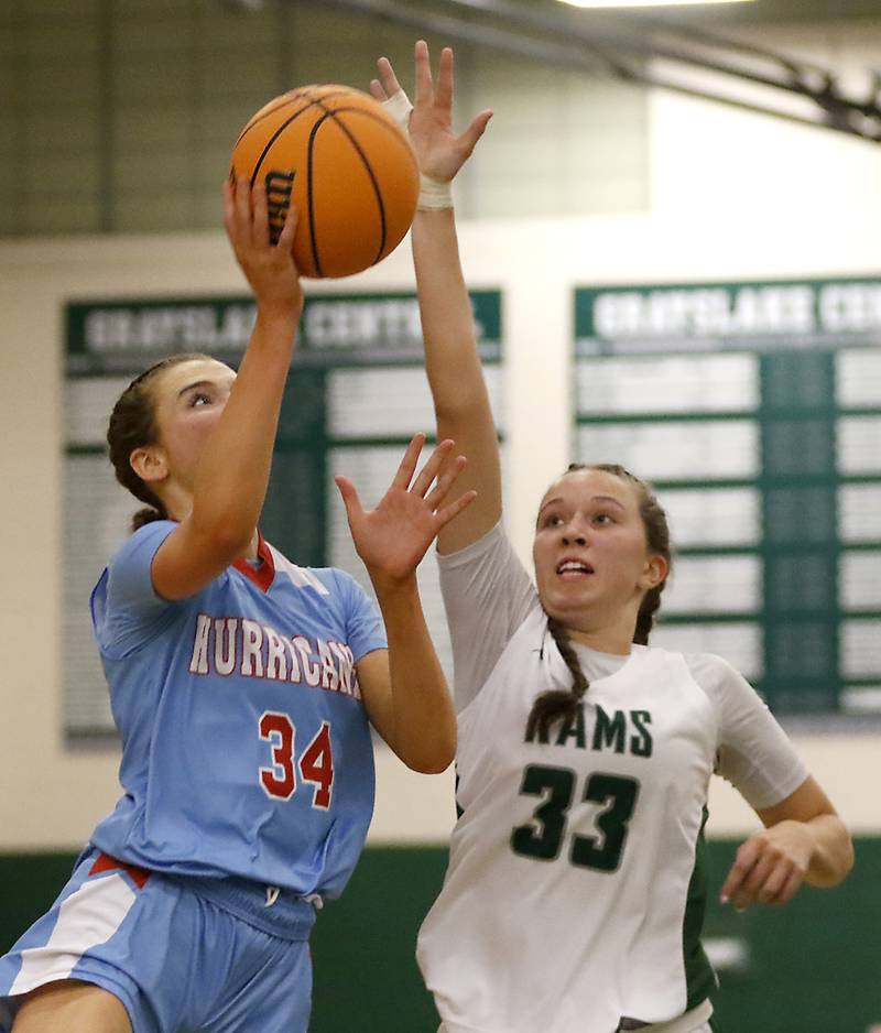 Marian Central's Juliette Huff shoots the ball in front of Grayslake Central's Madison Hoffmann during a nonconference girls basketball on Monday, Jan. 13, 2025, at Grayslake Central High School.