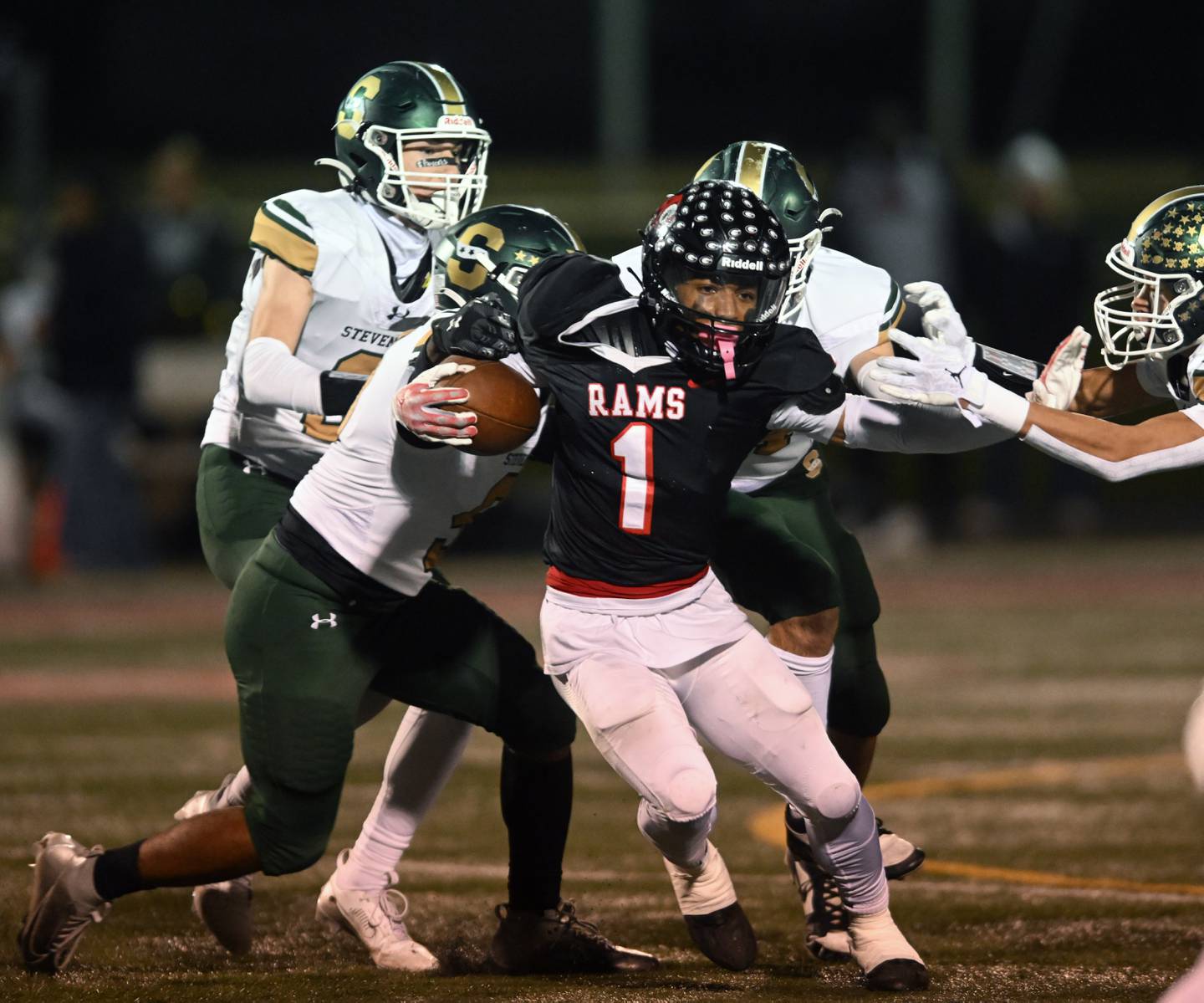 Glenbard East’s Amonte Cook carries the ball against Stevenson during the Class 8A second-round football playoff game on Friday, Nov. 8, 2024 in Lombard.