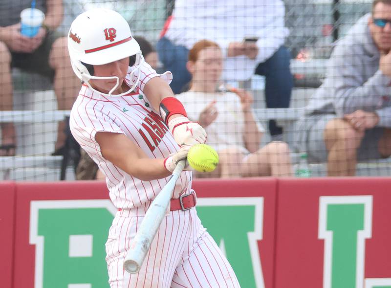 L-P's Anna Riva smacks a home run on this swing against Morton on Friday, March 20, 2026 at the L-P Athletic Complex in La Salle. Riva had three home runs in the game.