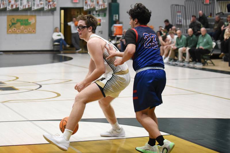 Bishop McNamara's Callaghan O'Connor, left, backs down Lycee Francais de Chicago's Jonathan Seif during a game at Bishop McNamara Wednesday, Feb. 18, 2026.