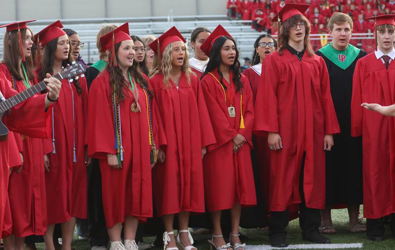 La Salle-Peru Township High School graduates sing "Good Riddance" (Time of Your Life) during the L-P Class of 2026 commencement ceremony on Thursday, May 14, 2026 at Howard Fellows Stadium.