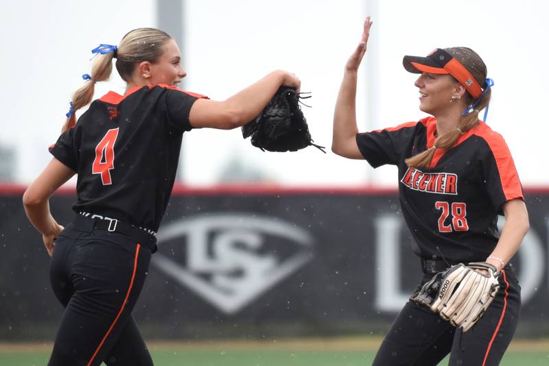 Beecher's Ava Olson, right, congratulates Ava Lorenzatti on her strikeout to end the second inning of the Class 2A State championship against Carterville Saturday, June 7, 2025 at the Louisville Slugger Complex in Peoria.