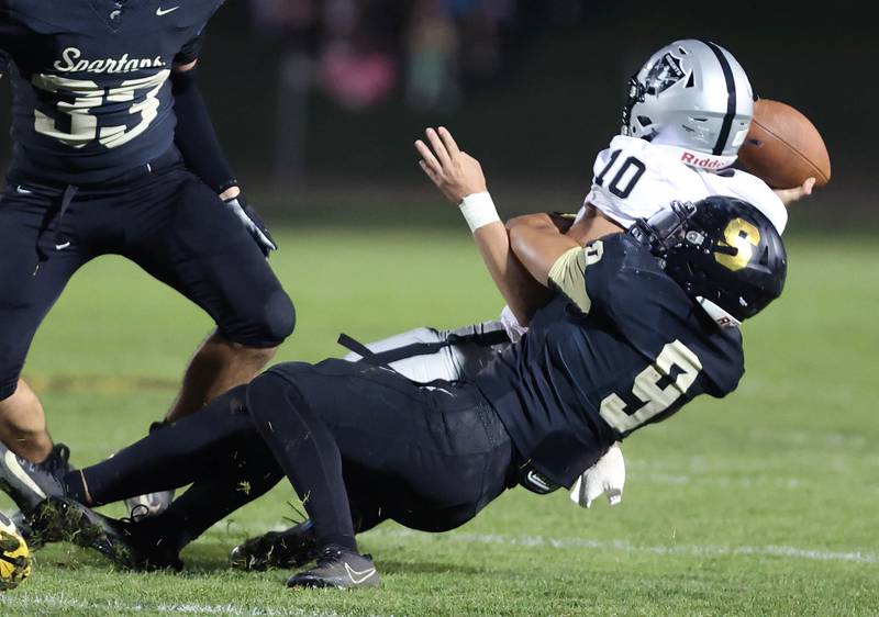 Sycamore's Miles Galindo sacks Kaneland's Troyer Carlson for a big loss during their game Friday, Sept. 29, 2023, at Sycamore High School.