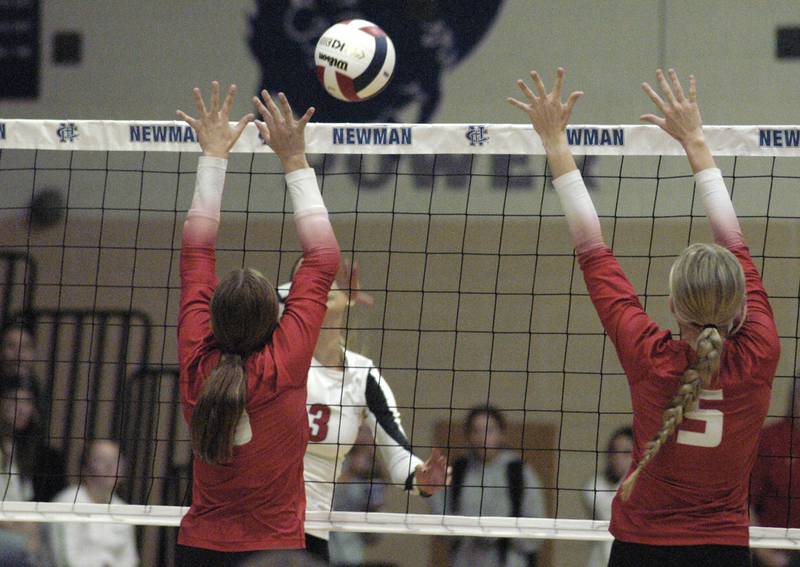 E-P's Kennedy Buck hits a ball between two Oregon defenders. Erie-Prophetstown took on Oregon in the Class 2A regional volleyball semifinal Tuesday, Oct. 29, 2024 at Newman High School.