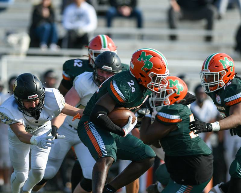 Morgan Park's Keshawn Lewis-Hunt (24) tries to get around Sycamore defenders during the first quarter of the game on Saturday Nov. 4, 2023, held at Gately Stadium in Chicago.