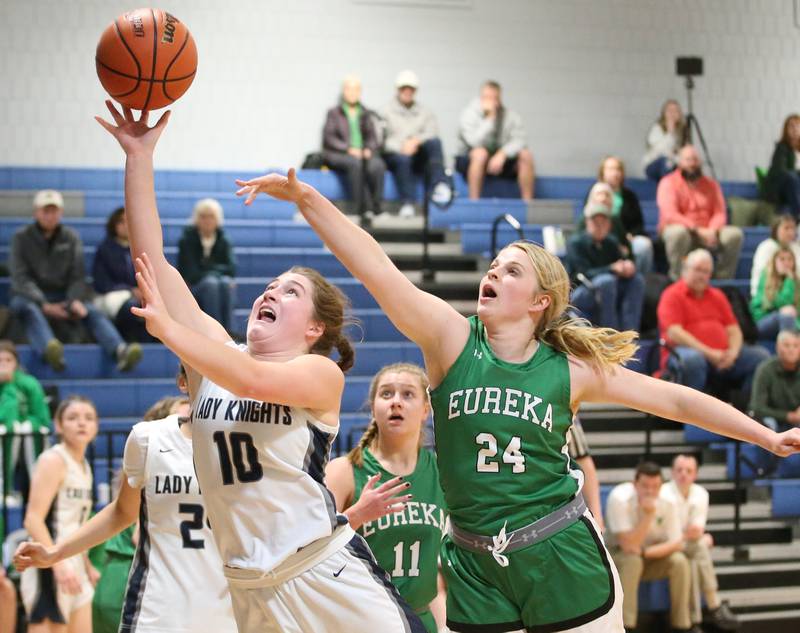 Fieldcrest's Carolyn Megrow gets past Eureka's Ella Ausmus to score on a drive to the basket on Monday, Jan. 9, 2023 at Fieldcrest High School.