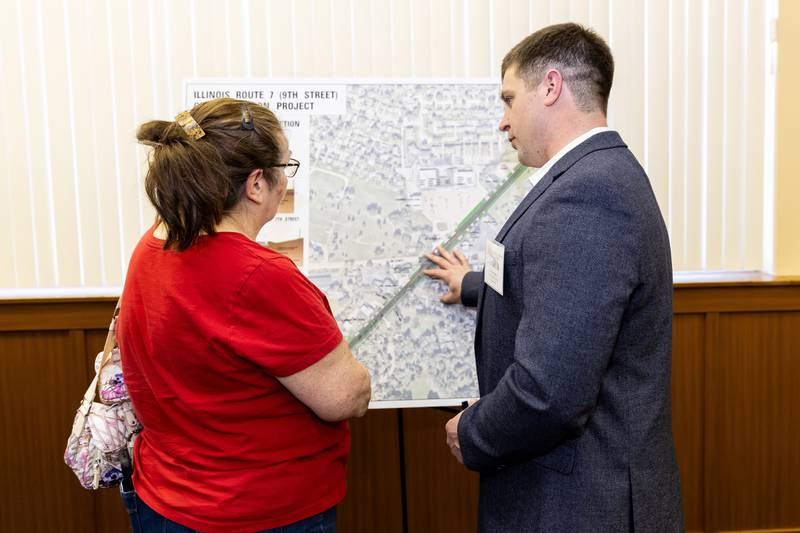 Lockport resident Irene Smith, chats with Dan Schroeder from Christopher B. Burke Engineering about the Illinois Route 7 Channelization Project plans during the pre-construction open house at Lockport City Hall on April 15, 2024. (Laurie Fanelli for Shaw Local News Network)