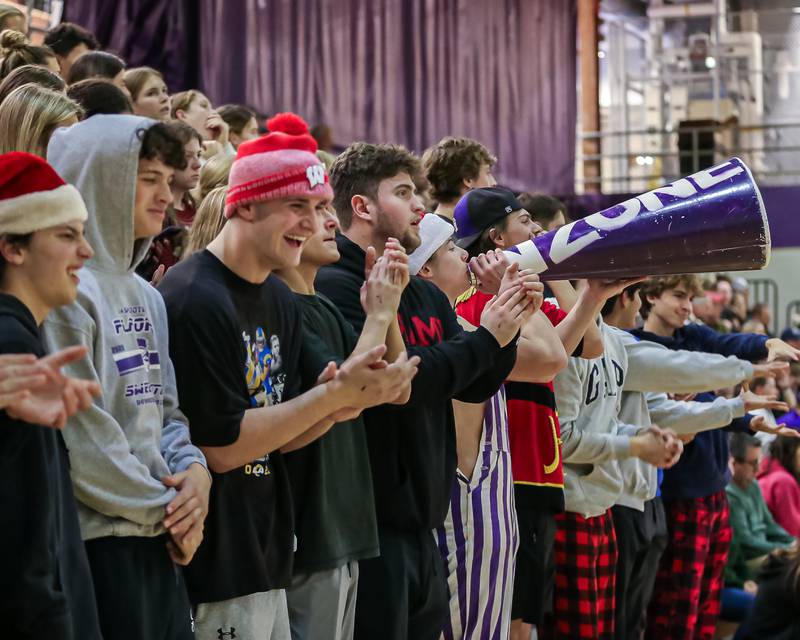 The Downers Grove North student section cheers on the team during basketball game between Downers Grove South at Downers Grove North. Dec 16, 2023.