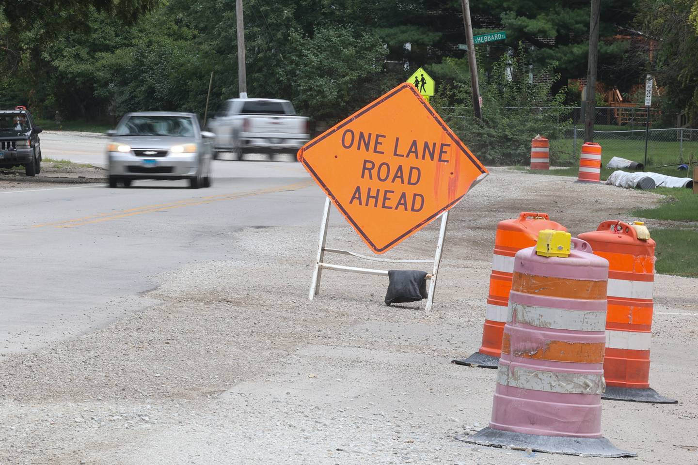 A lane closure sign sits on recent water line work along East Washington Street in Joliet. Thursday, August 4, 2022 in Joliet.