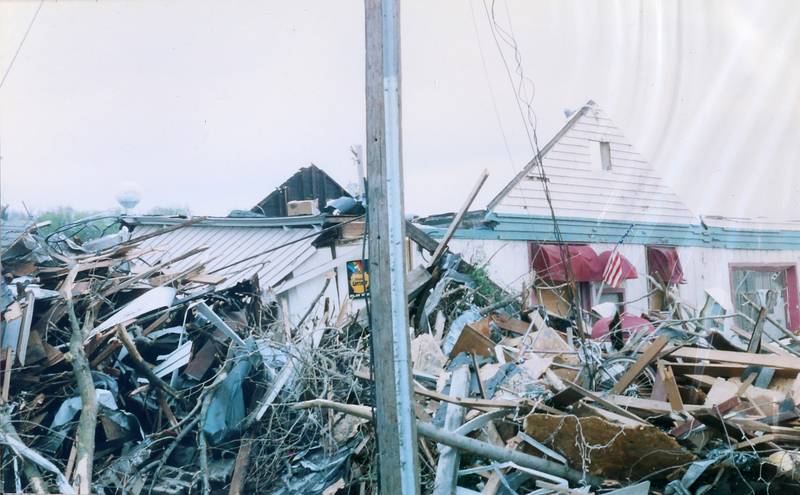 Tornado debris from Starved Rock Bait and Tackle lay scattered around the shop on Wednesday April 21, 2004 downtown Utica.