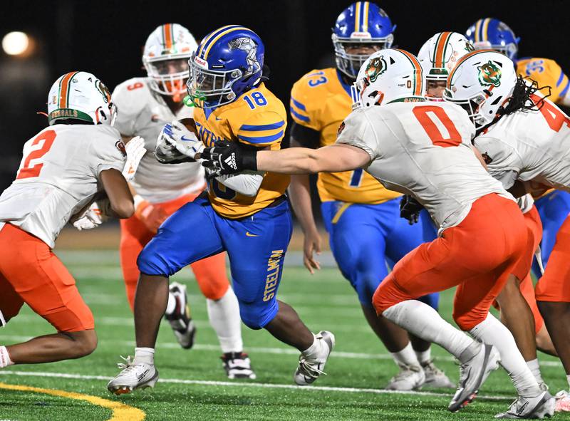 Joliet Central's Tristen Sellers (18) rushes the ball during the conference game against Plainfield East on Friday, SEP. 12, 2025, at Joliet.