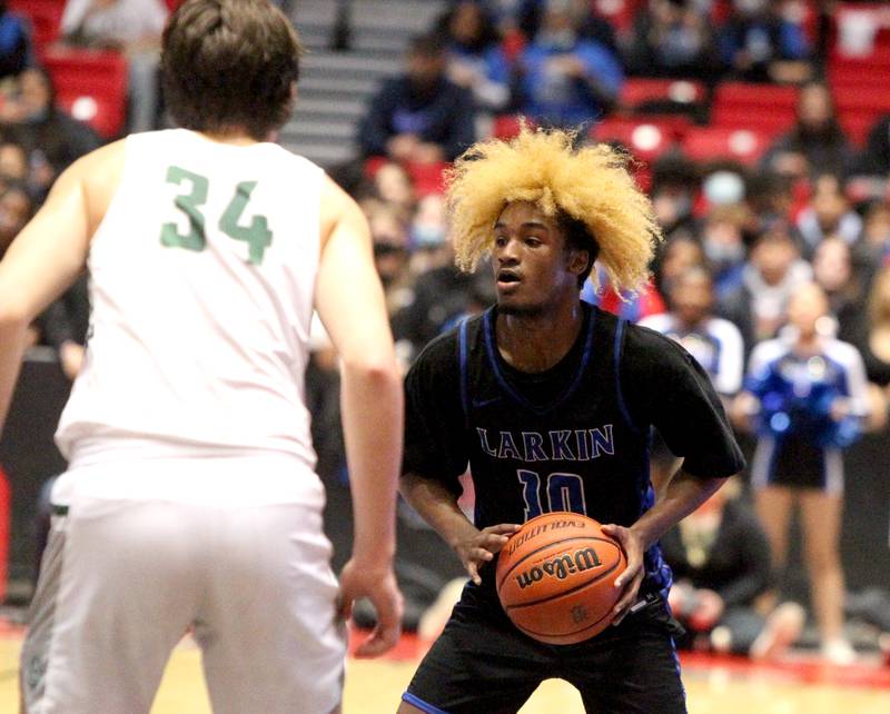 Larkin’s Damari Wheeler-Thomas looks to pass the ball during a 4A DeKalb Supersectional game against Glenbard West at the Northern Illinois University Convocation Center on Monday, March 7, 2022.