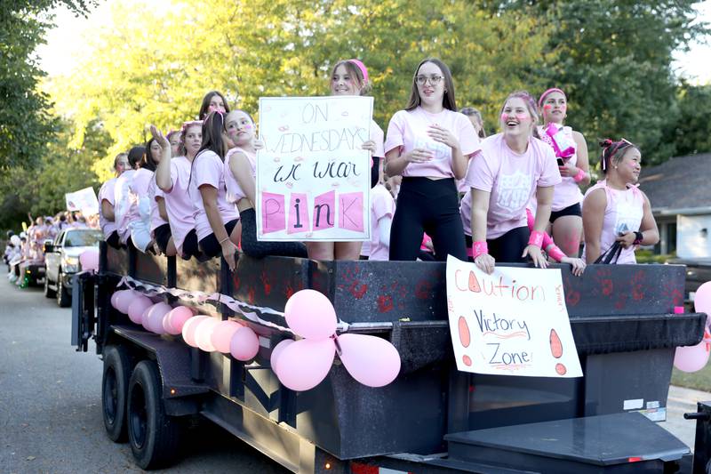 Kaneland High School students ride on a float on Wednesday, Oct. 2, 2024 during the school’s homecoming parade in Elburn.