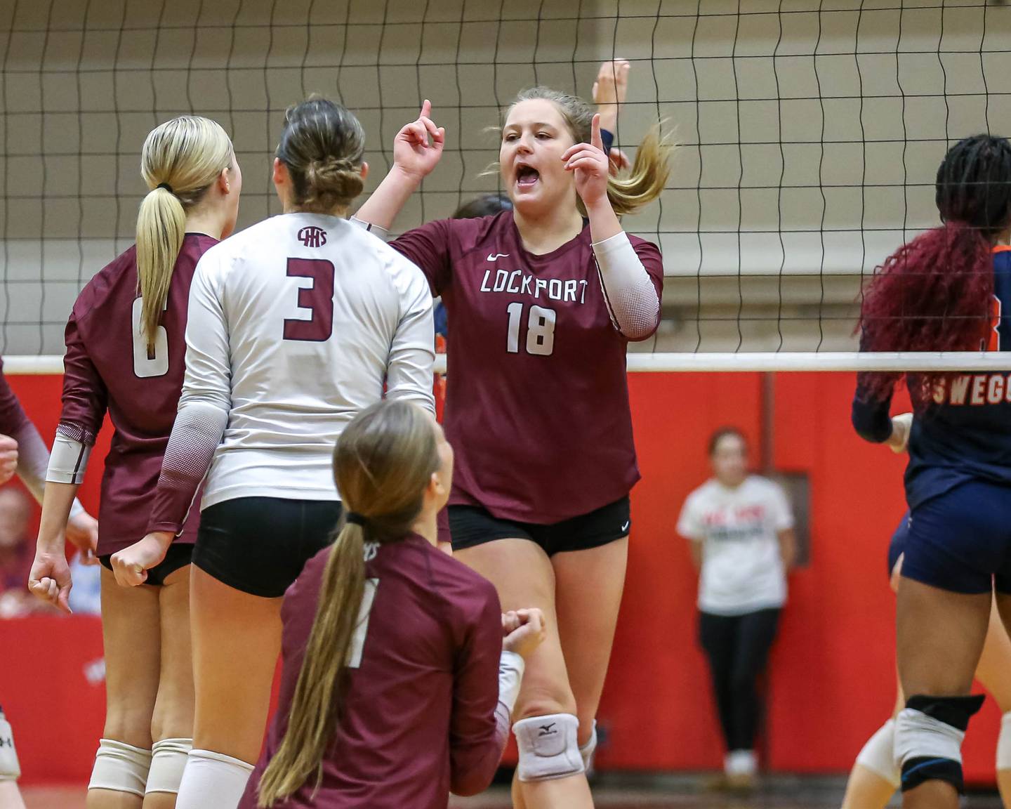 Lockport's Jenna Kolosta (18) signals one more point for the win after her kill during Class 4A Bolingbrook Sectional final match between Lockport at Oswego.  Nov 7, 2024  in Bolingbrook.