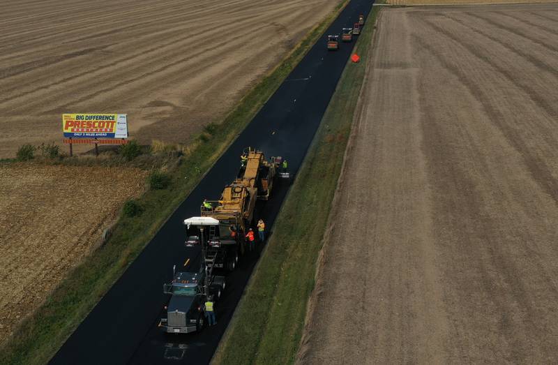 Crews resurface Illinois Route 251 on Friday, Oct. 17, 2025 near the intersectikon of North 39th Road just south of Mendota. Resurfacing work consists of patching and resurfacing, which is expected to be completed in mid-November. The work zone stretches from the BNSF railroad bridge south of Mendota to just north of Interstate 80 in Peru. The construction will continue into the spring with earth work. Motorists are asked to drive with caution through the construction zone. The Route 251 work between Mendota and Peru will lead to daily lane closures controlled by flaggers.