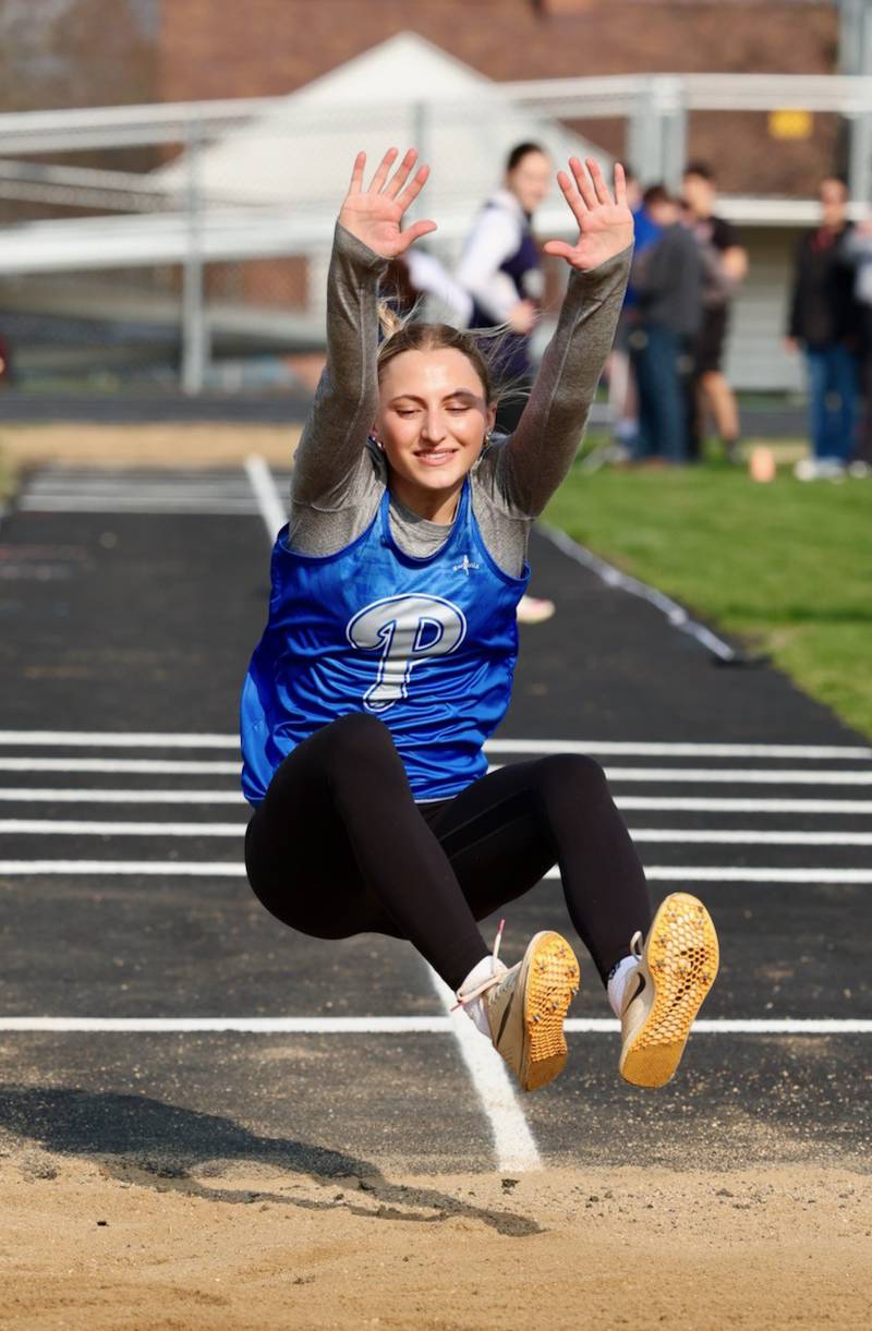 Princeton senior Ashlynn Weber soars in the triple jump in Thursday's Howard-Monier Invite. She won both the long jump and triple jump.