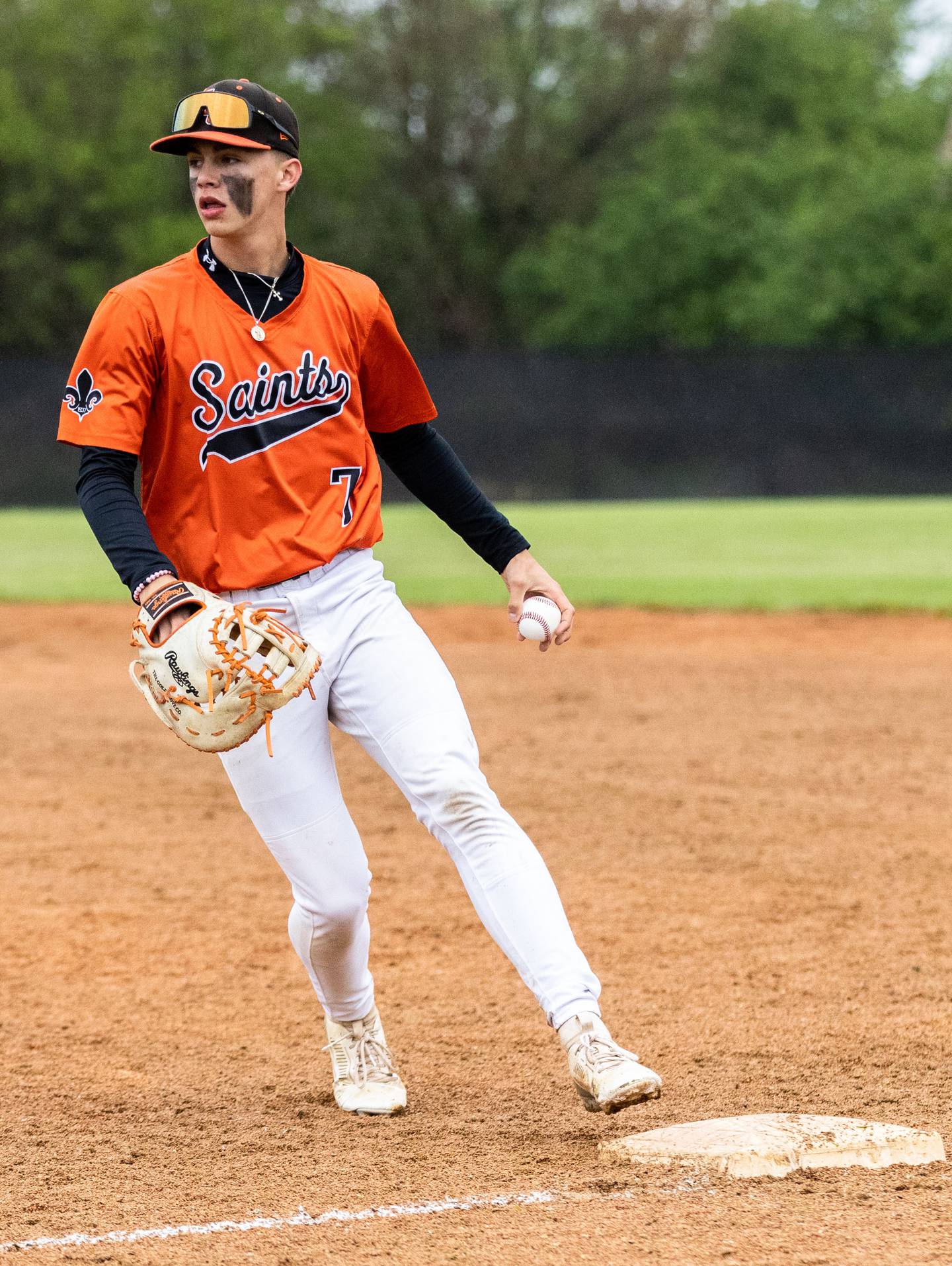 St. Charles East first baseman Dylan McCabe tags first for an out during a game against Wheaton Warrenville South in Wheaton on Wednesday, May 21, 2025.