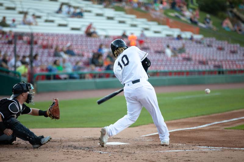 Second baseman Sherman Johnson swings at a pitch during a game against the Milwaukee Milkmen at Northwestern Medicine Field on Friday, July 29, 2022.