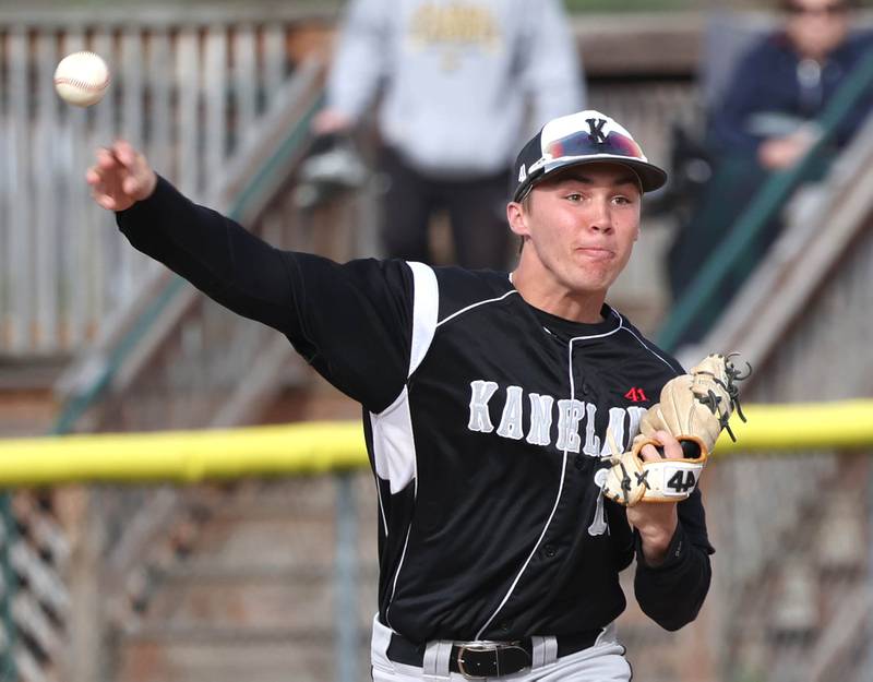 Kaneland's Preston Popovich throws the ball to first during their game against Sycamore Monday, April 22, 2024, at the Sycamore Community Sports Complex.