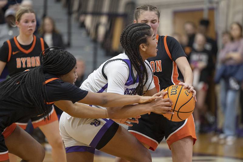 Dixon’s Ahmyrie McGowan is called for traveling late in the game against Byron Saturday, Dec. 27, at the Duchesses Basketball Christmas Classic.