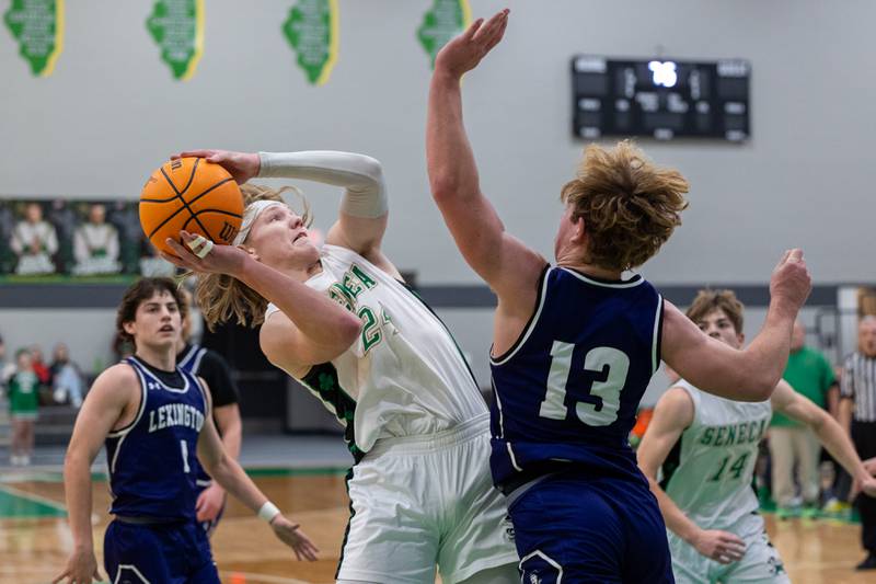 Grant Seigel of Seneca shoots contested shot in paint against Joe Cheever of Lexington on Saturday, December 28, 2024 at Seneca High School in Seneca.