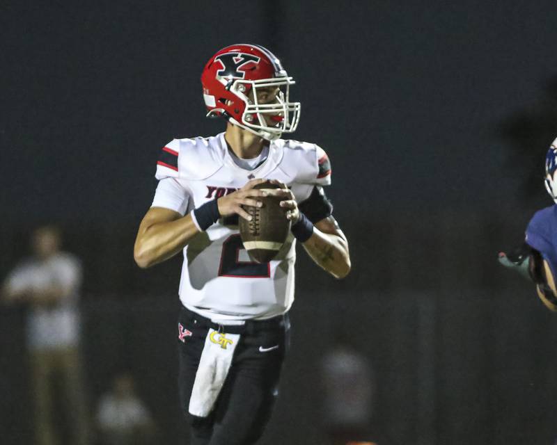 Yorkville's Jack Beetham (2) drops back during football game between Yorkville at Oswego Friday, Sept 26, 2025 in Oswego.