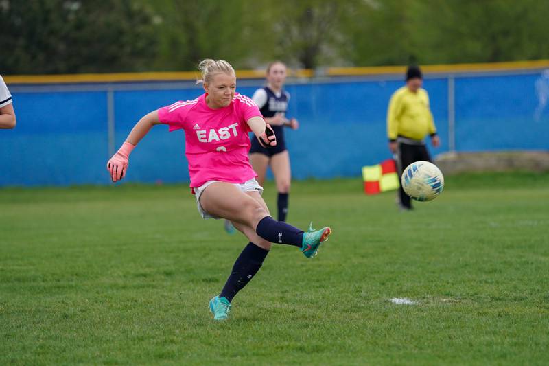 Oswego East's Madelynn McGregor (0) puts the ball in play off of a free kick against Oswego during a soccer match at Oswego East High School on Tuesday, April 23, 2024.
