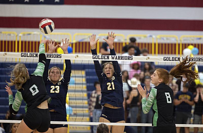 Sterling’s Sienna Stingley and Kirra Gibson go up to block a shot against Alleman’s Emilye Polich  Monday, Sept. 18, 2023.