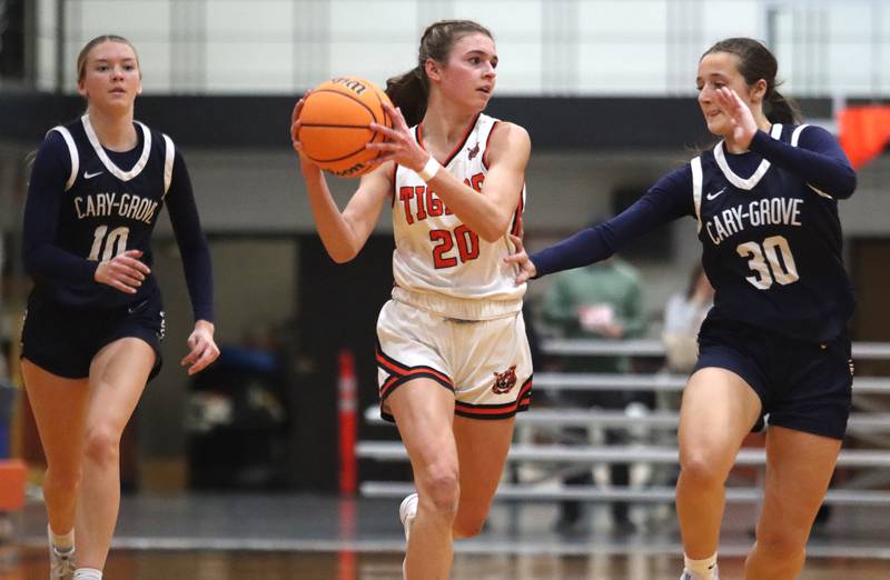 Cary-Grove’s Alivia Nelson, left, and Samantha Skerl, right, pursue Crystal Lake Central’s Hadley Ferrero in varsity girls basketball on Tuesday, Jan. 7, 2025, at Crystal Lake Central High School in Crystal Lake.