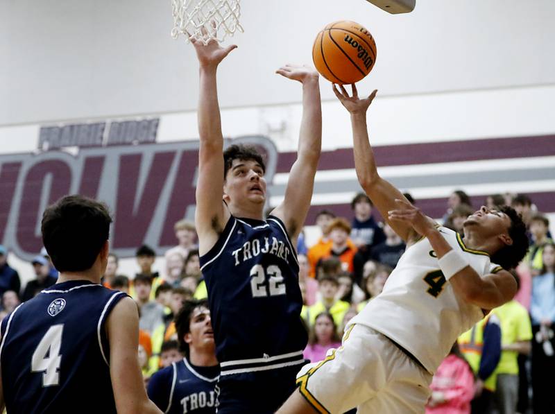 Crystal Lake South's Anthony Demirov uses his finger tips to score a basket in front of Cary-Grove's Adam Bauer during the IHSA Class 3A Prairie Ridge Regional championship basketball game on Friday, Feb. 28, 2025, at Prairie Ridge High School in Crystal Lake.
