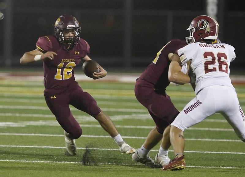 Richmond-Burton's Nick Falasca runs with the ball behind the block of a teammate during a Kishwaukee River Conference / Interstate 8 Conference crossover football game Friday, Sept. 30, 2022, between Richmond-Burton and Morris at Richmond-Burton Community High School in Richmond.