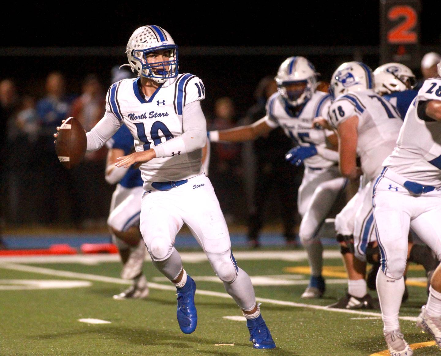 St. Charles North quarterback Ethan Plumb looks to pass the ball on Friday, Oct. 25, 2024 during a game at Geneva.