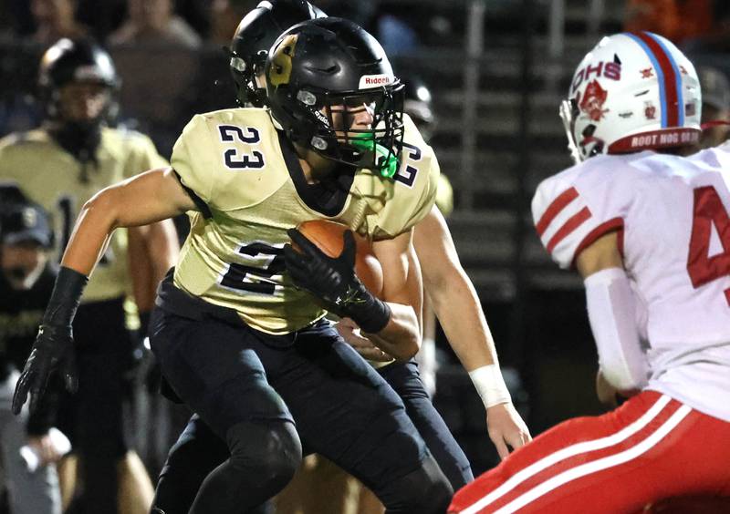 Sycamore's Dylan Hodges looks to get by Ottawa's Joey Liebhart during their game Friday, Sept. 27, 2024, at Sycamore High School.