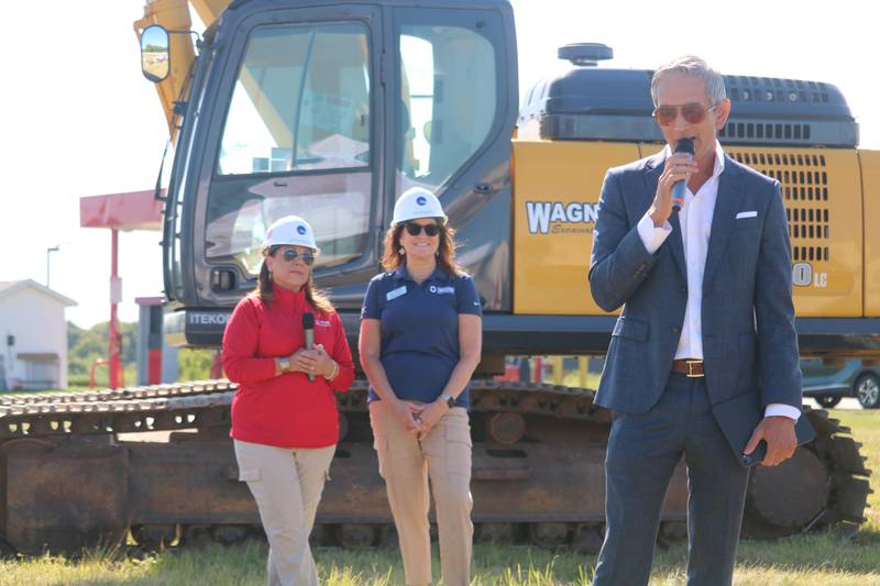 Pramit Patel (right) gives remarks Tuesday, Aug. 26, 2025, at a groundbreaking ceremony for a new Marriott-branded hotel, as Cortney Strohaker (left) and Melissa Amedeo watch on.