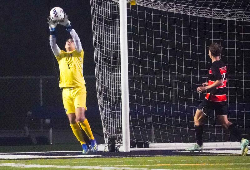 West Chicago's Julian Nicoski-Rios (1) makes a save against St. Charles East during a class 3A sectional semifinal soccer match at West Chicago High School on Wednesday, Oct. 25, 2023.