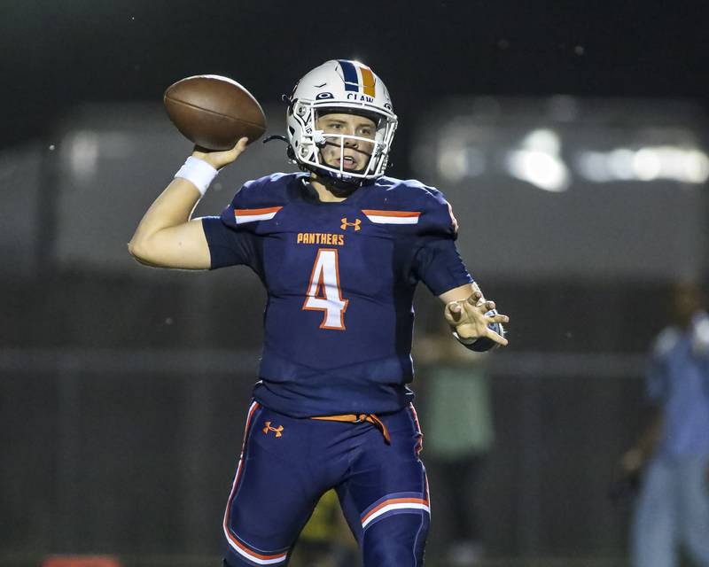 Oswego's Drew Kleinhans (4) passes during football game between Yorkville at Oswego Friday, Sept 26, 2025 in Oswego.