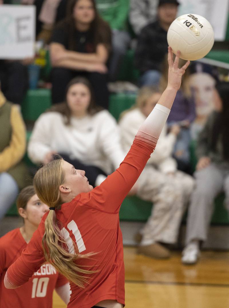 Oregon’s Izzy Berg plays the ball over the net against Rock Falls Wednesday, Oct. 22, 2025.