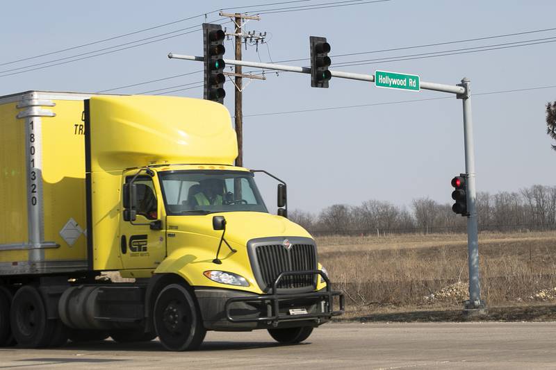 Cars pass down rt. 6 at the intersection of Hollywood Rd. on Tuesday, March 9, 2021, in Joliet, Ill. A bridge across the Des Plaines River is proposed at the intersection of Rt. 6 and Houbolt Road.